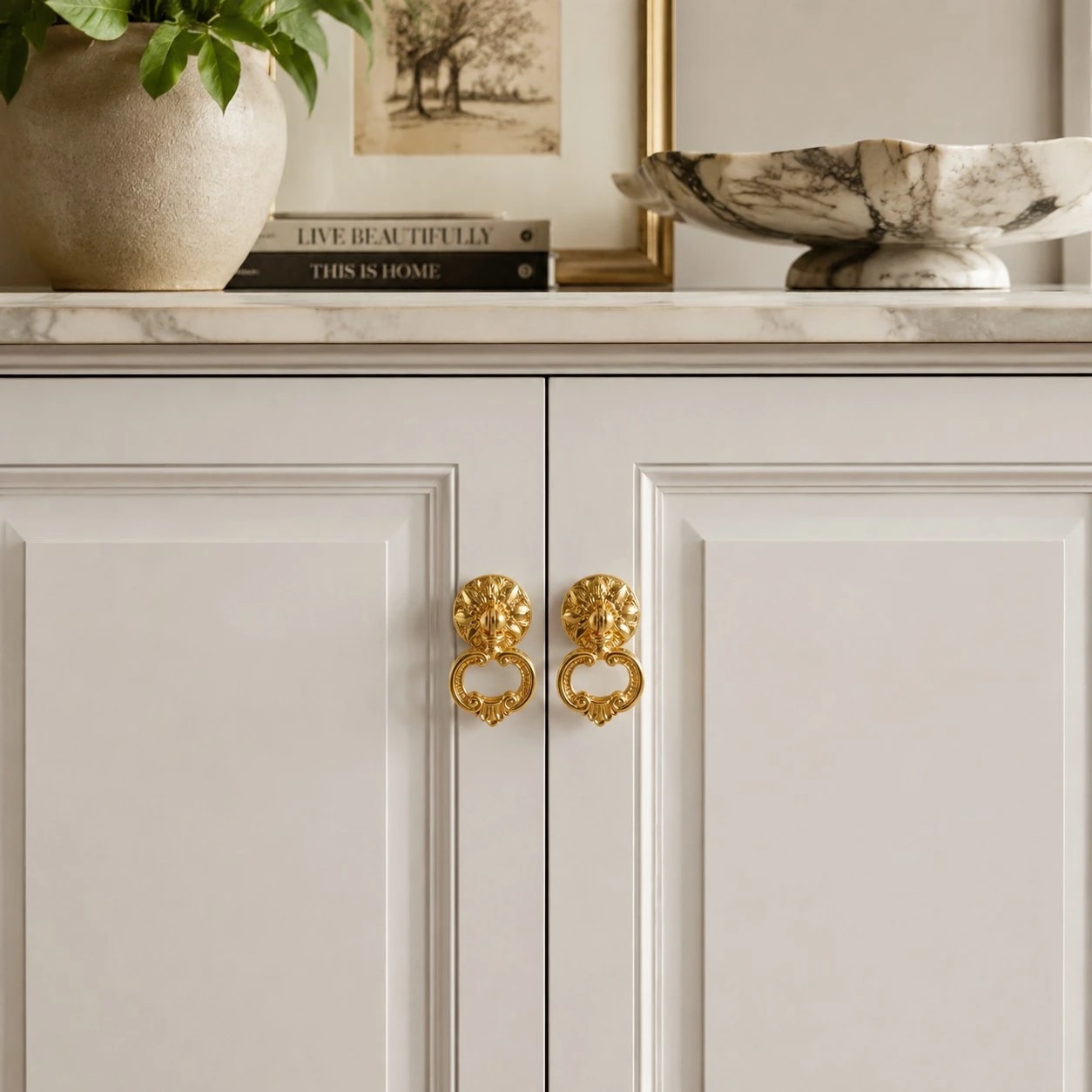 Brass ring pulls on white cabinet doors