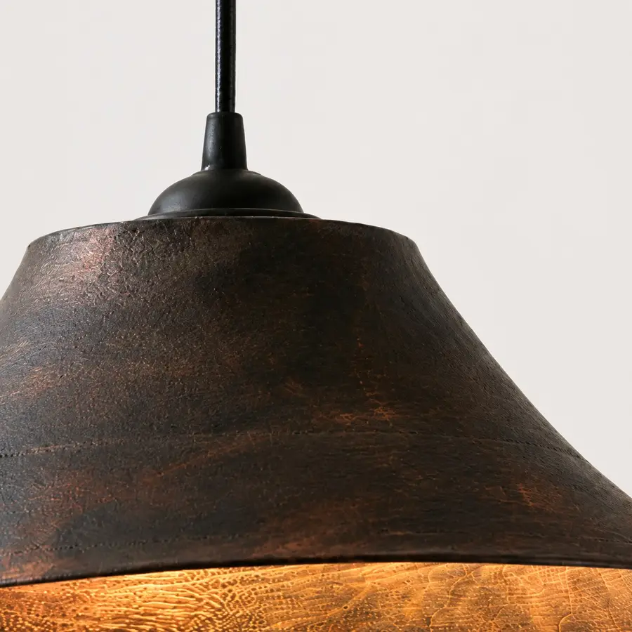 close view of the dark wood shade surface and inner grain