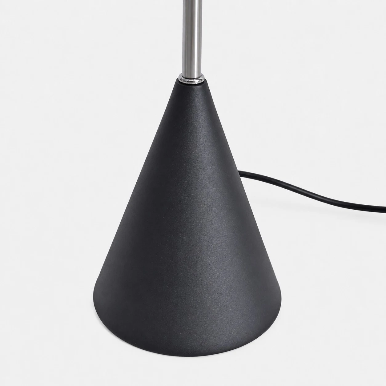 Weighted cone base and cord detail