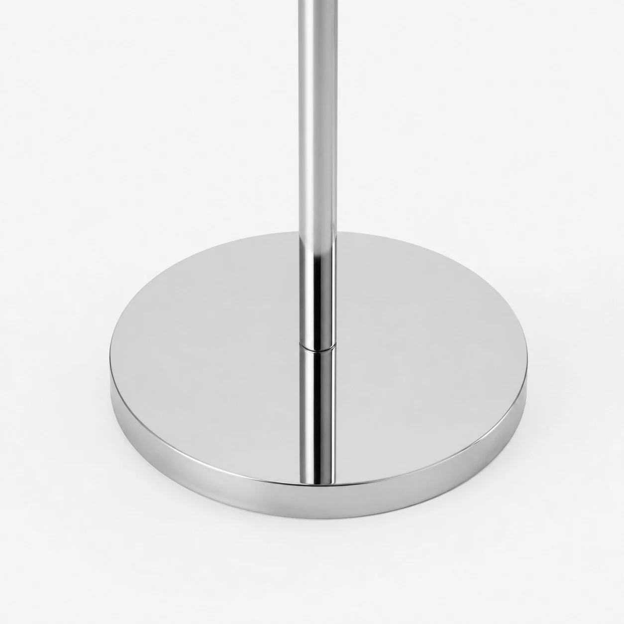 Chrome round floor lamp base detail