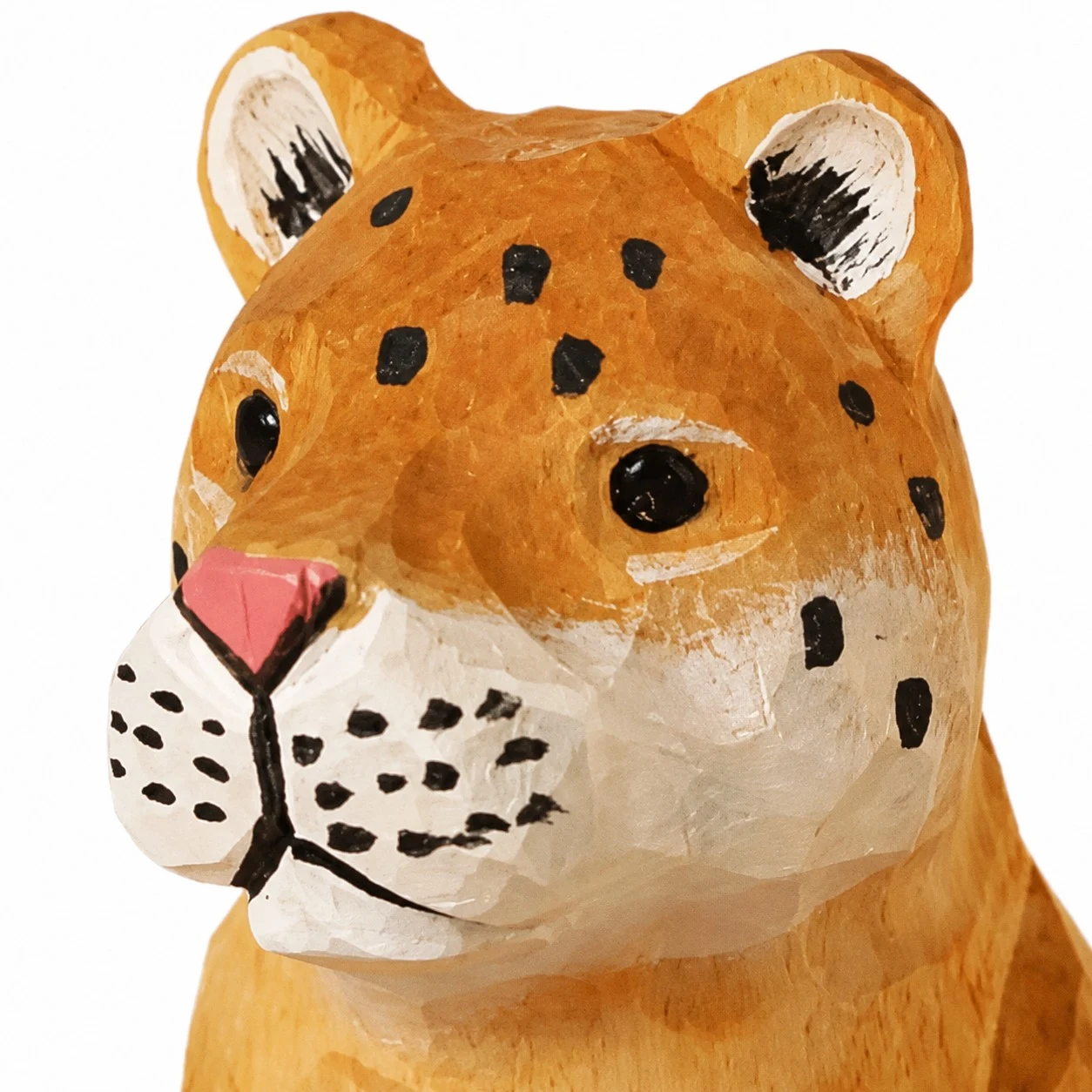 Hand carved wooden leopard face and spotted detail
