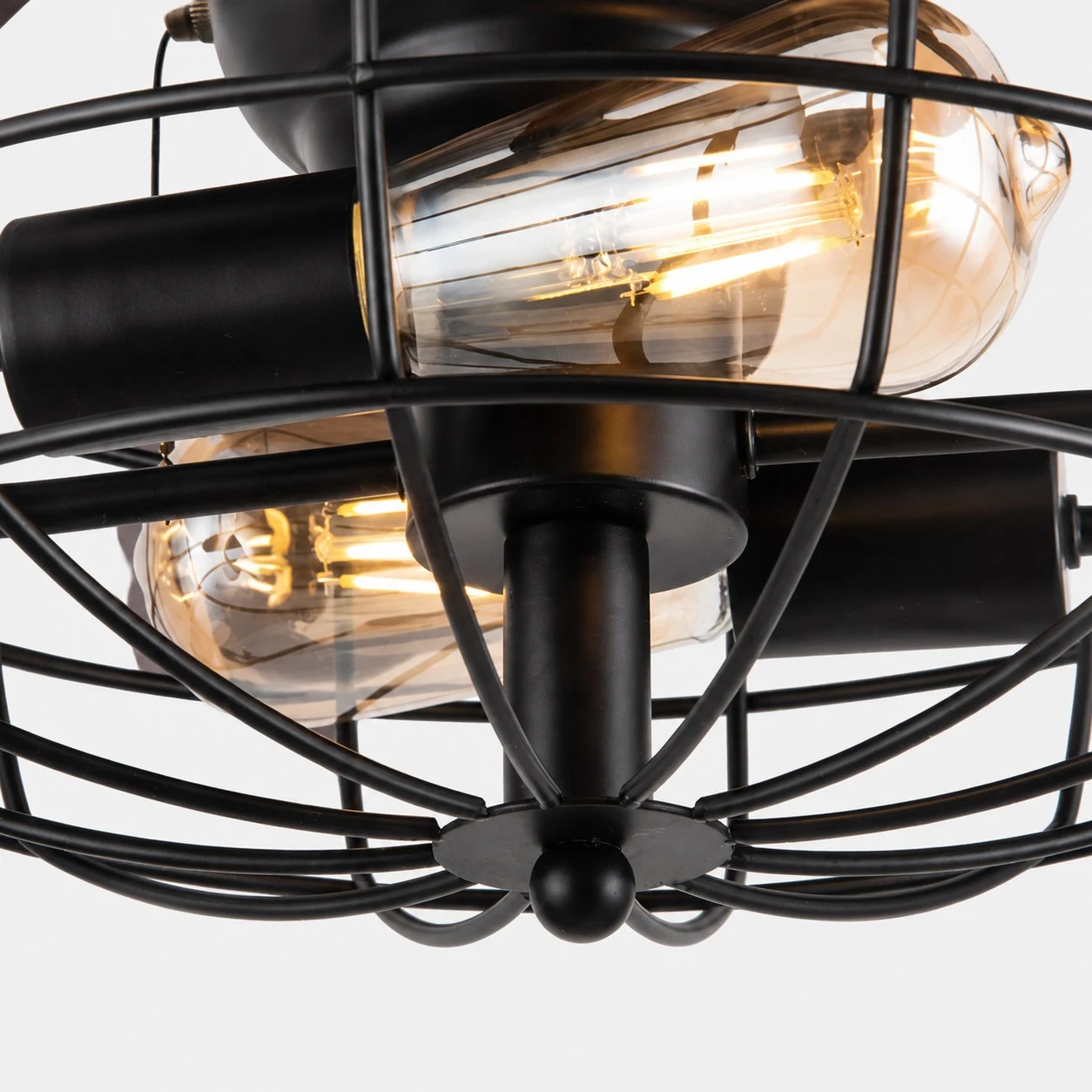 Close view of caged bulb frame and warm light