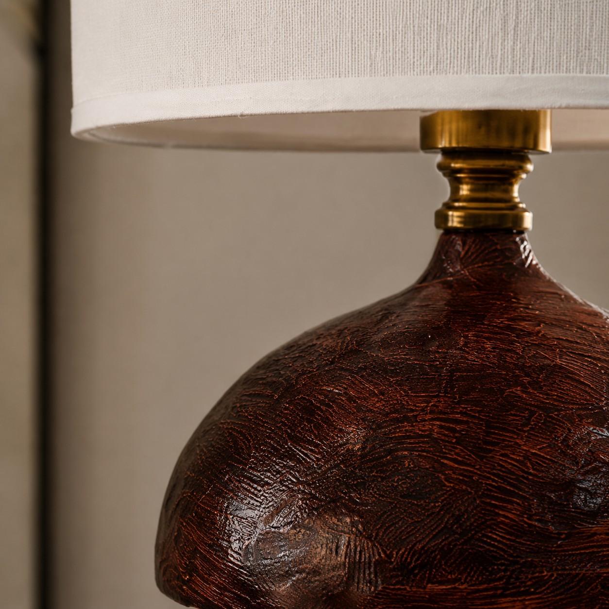Close view of textured wood-grain resin body and shade edge