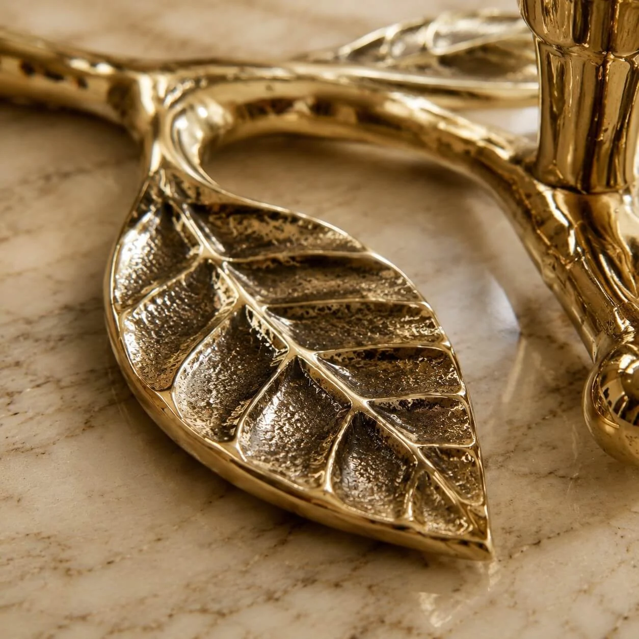 Leaf casting detail on brass candlestick