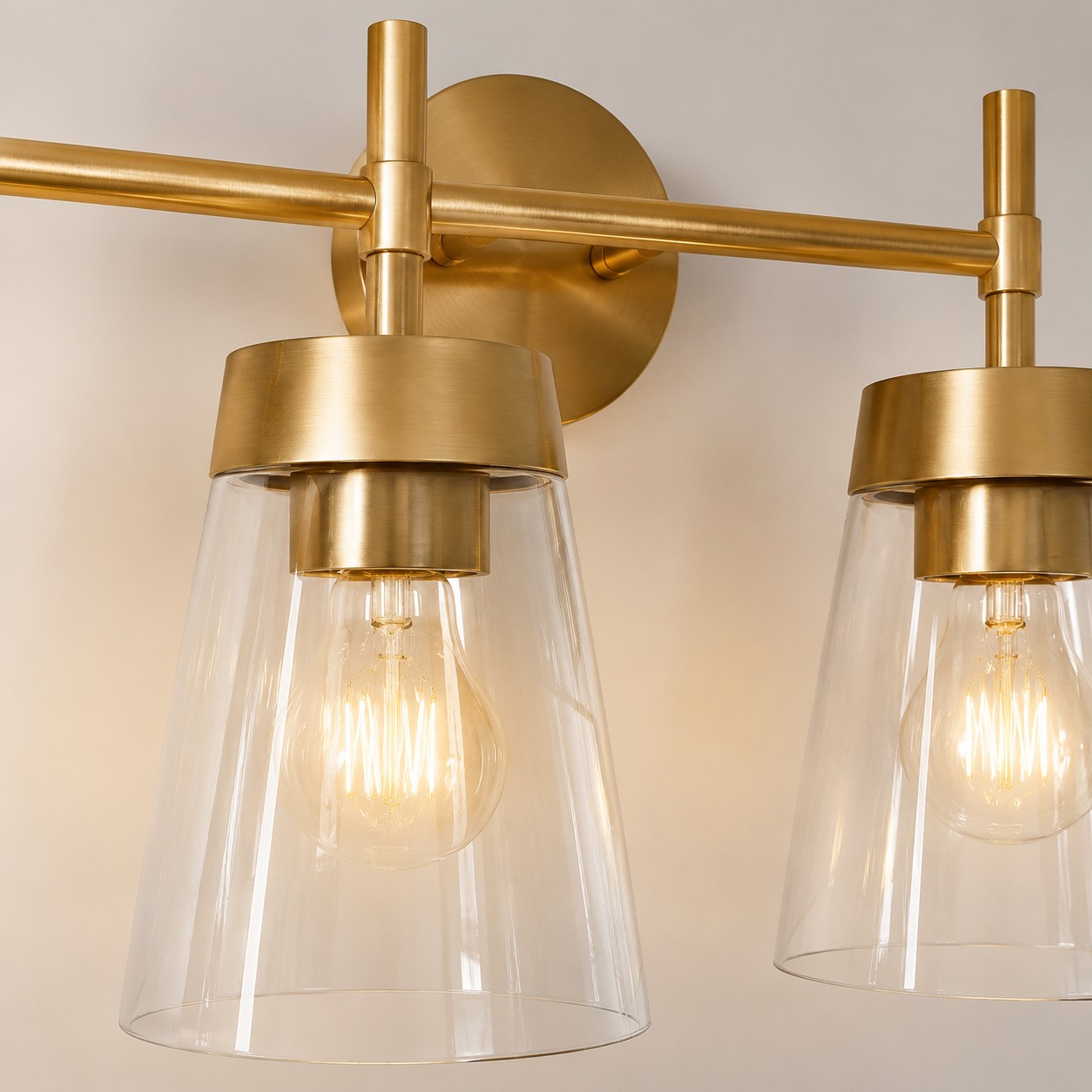 Brushed brass vanity light clear glass shade detail