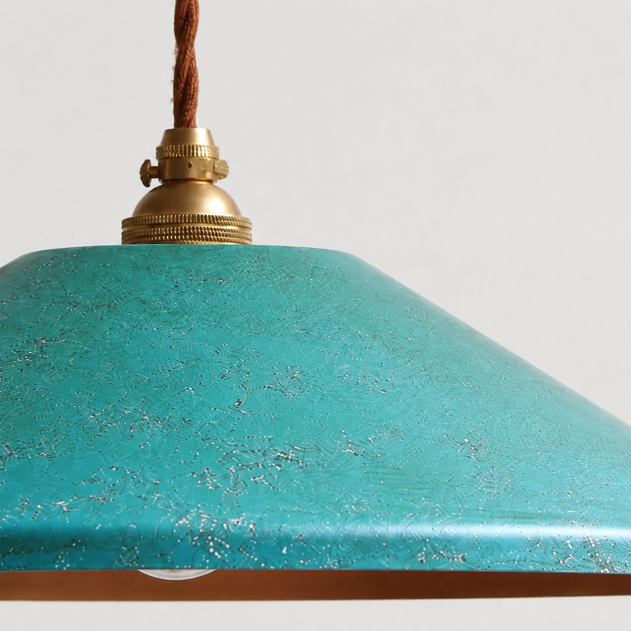 blue hand-rusted shade texture close-up with brass cap