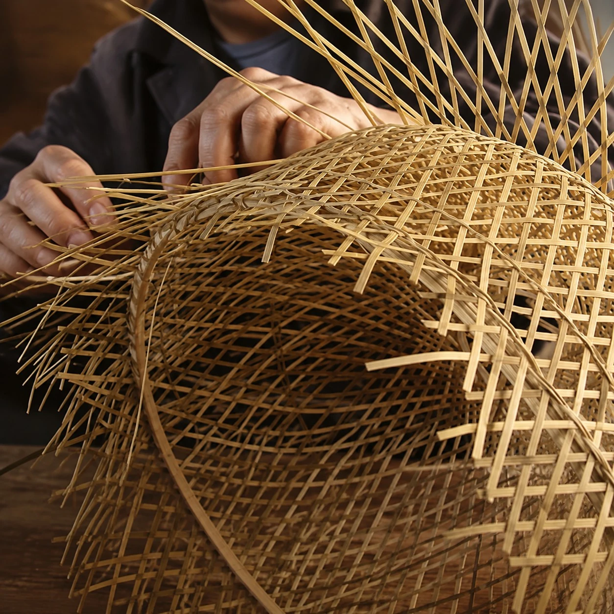 Hand weaving the rattan shade
