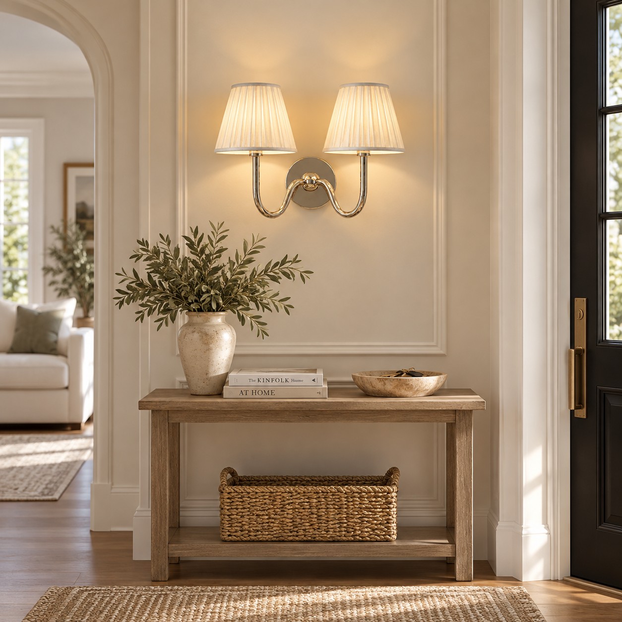 Two-light chrome Tansy sconce above an entry console