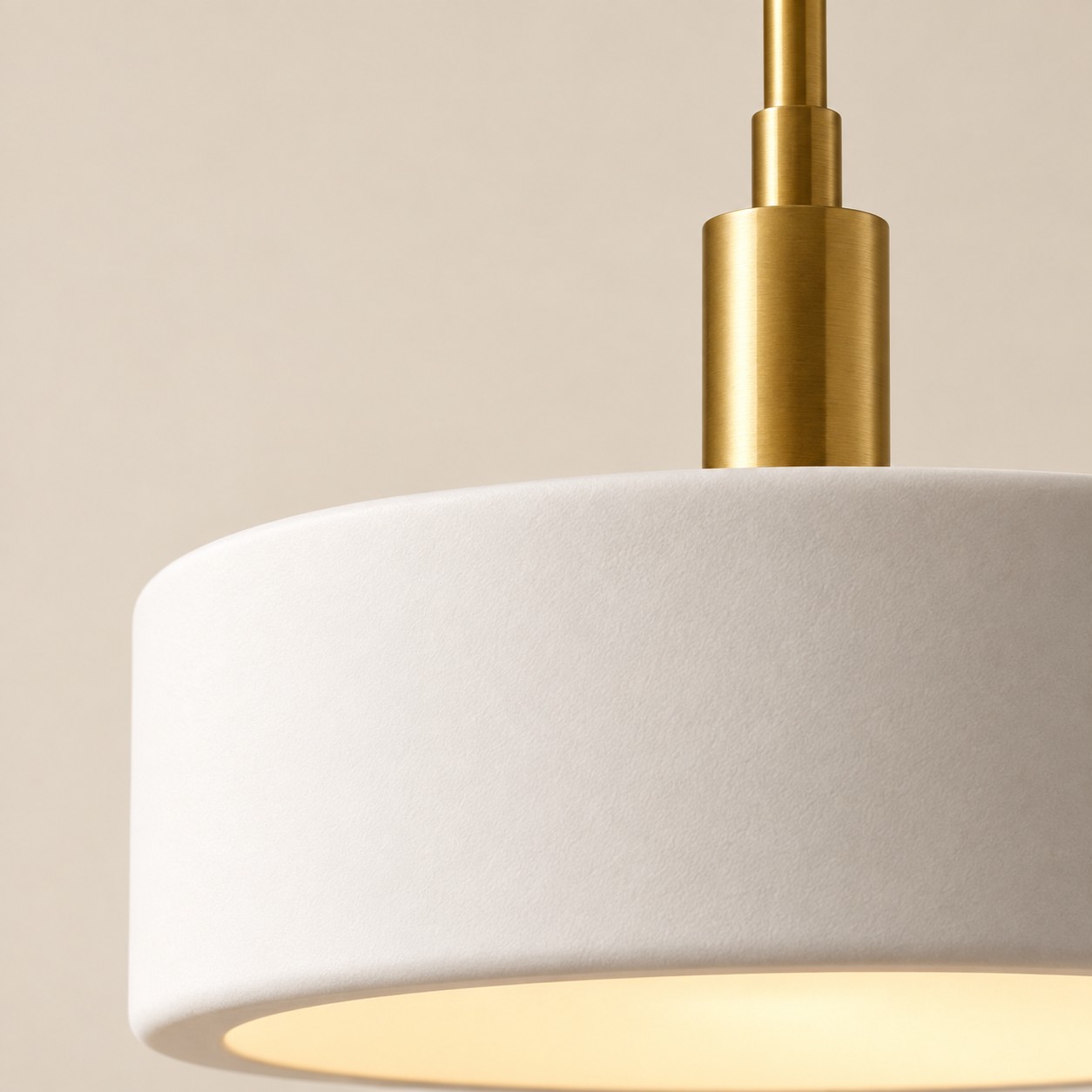 Matte ivory porcelain drum wall with a warm open base