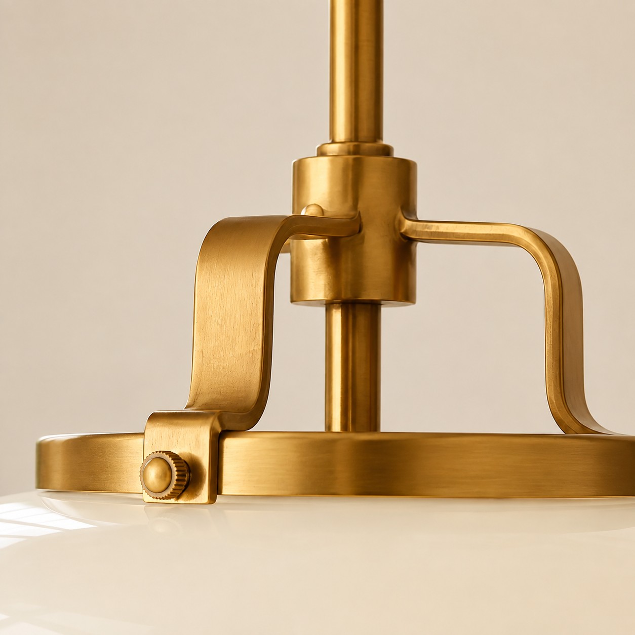 Antique brass saddle and knurled pin on the milk glass drum