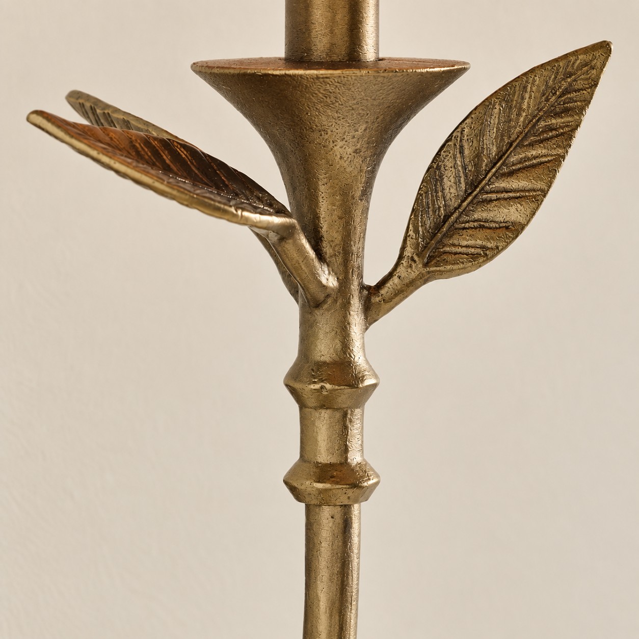 Forged antique brass leaves at the candle cup