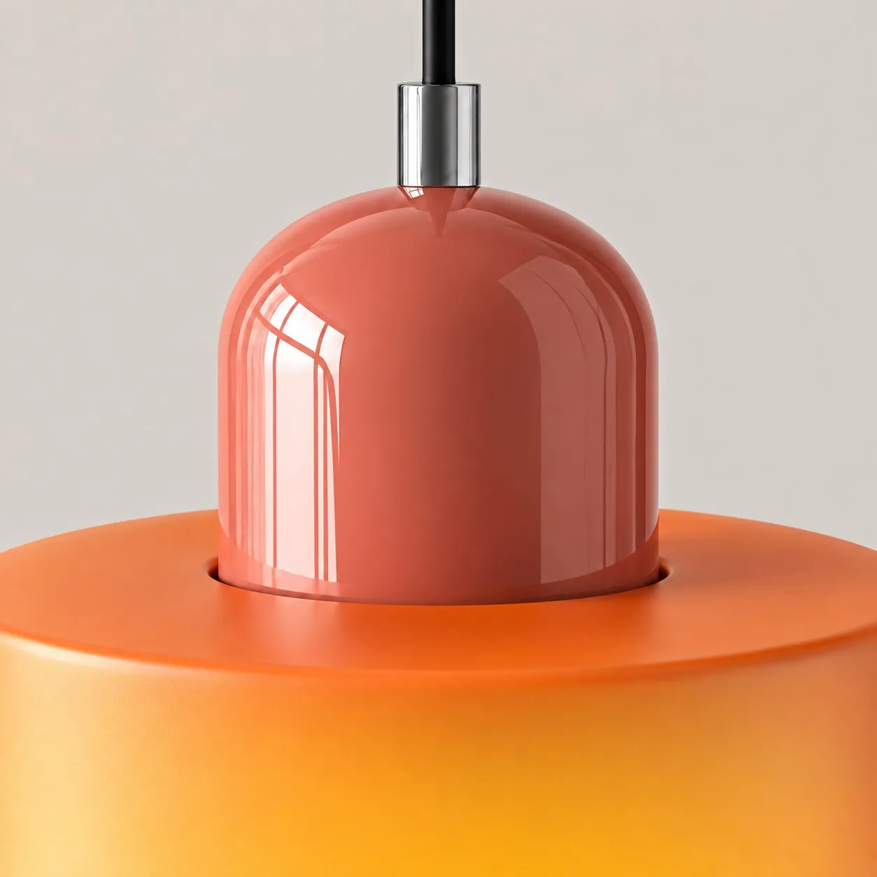 A domed cap sits in the open top of a colored glass cylinder