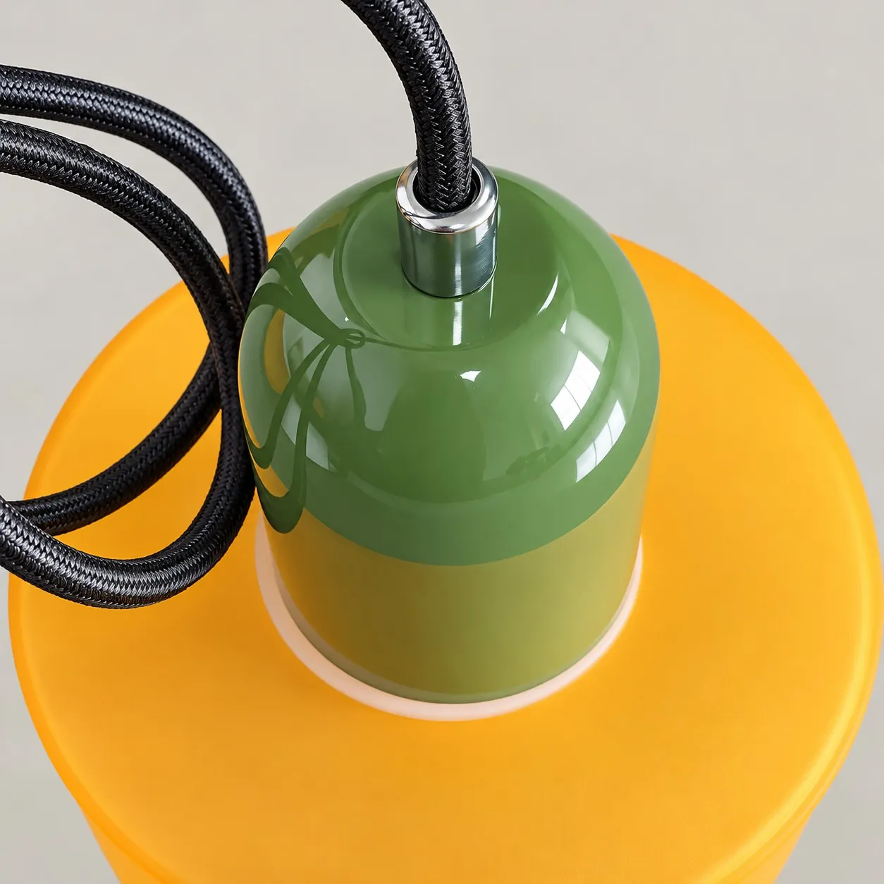 Black braided cord and a metal sleeve on the domed cap
